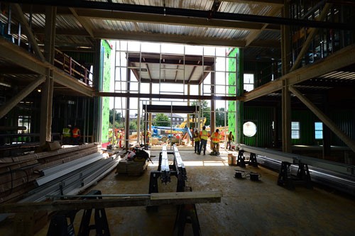 Work proceeds on the entrance of the College of Humanites and Behavioral Sciences Building