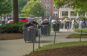 Volunteers help incoming students as they move into Muse Hall on Thursday morning at Radford University.