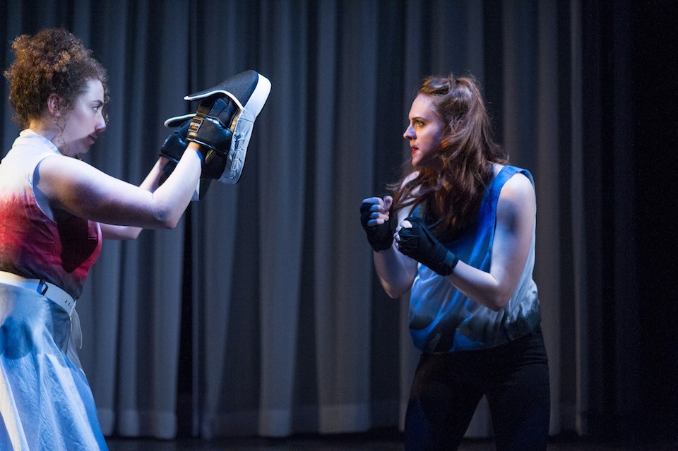 Desdemona, portrayed by Kelsey Godfrey, right, practices boxing in one of the contemporary scenes in "Othello."